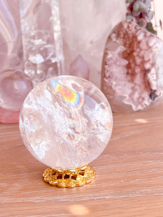 Rainbow clear quartz with hematite inclusions